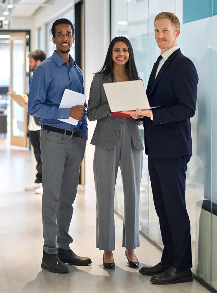 Three business professionals standing together
