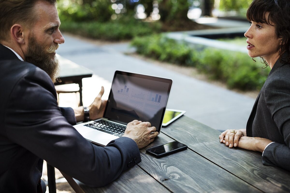 A representative going through service options with a customer at a table
