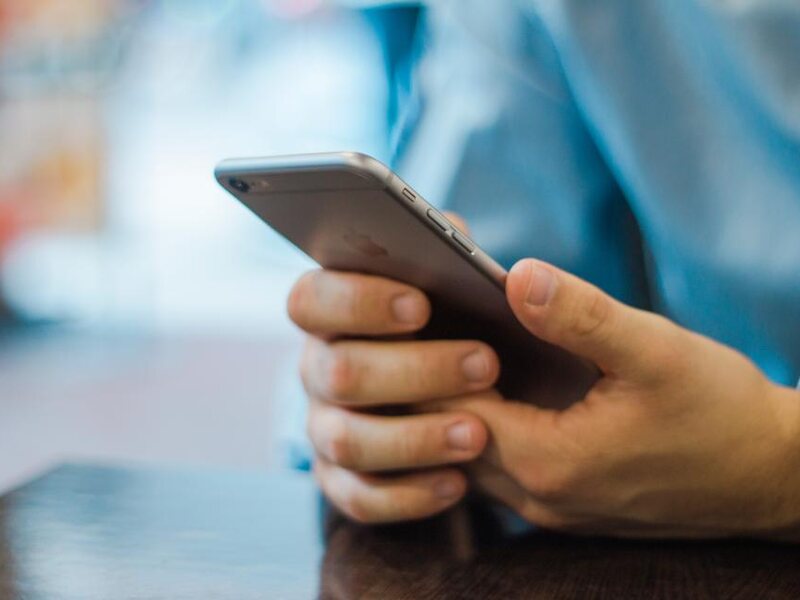 A person reviewing a mobile service plan on a smartphone