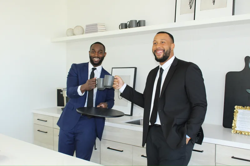 Two RAD team members with a coffee in the office kitchen