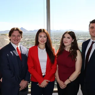 Five RAD team members in front of the Phoenix city view
