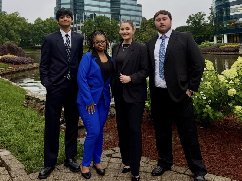Four TriMkt team members outside the Raleigh office