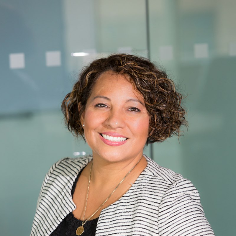 Smiling mentor in a bright office