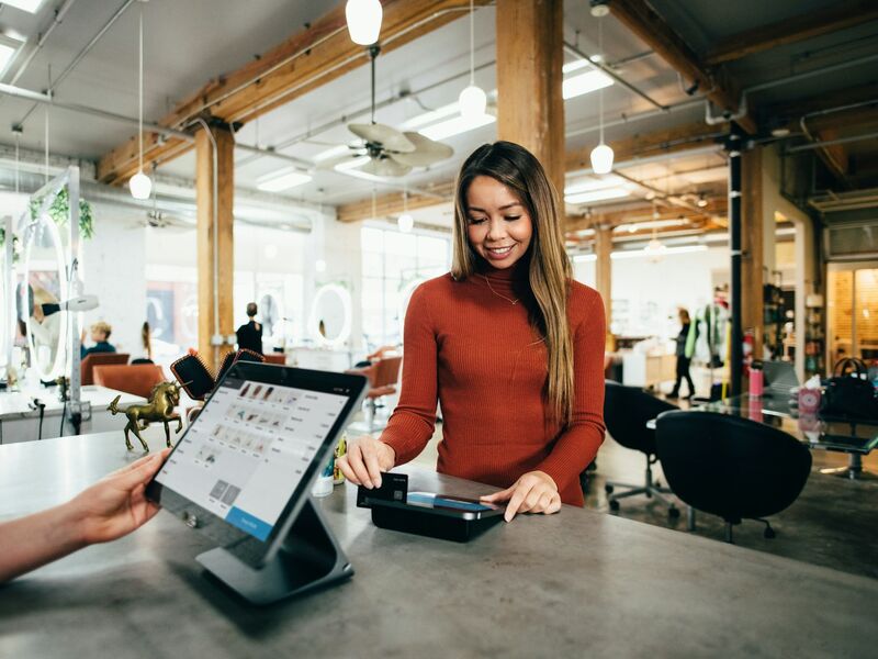 Friendly support specialist wearing a headset helping a customer