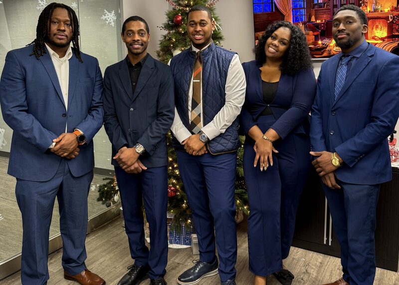 The Capacity Expansion Co team standing together in professional attire
