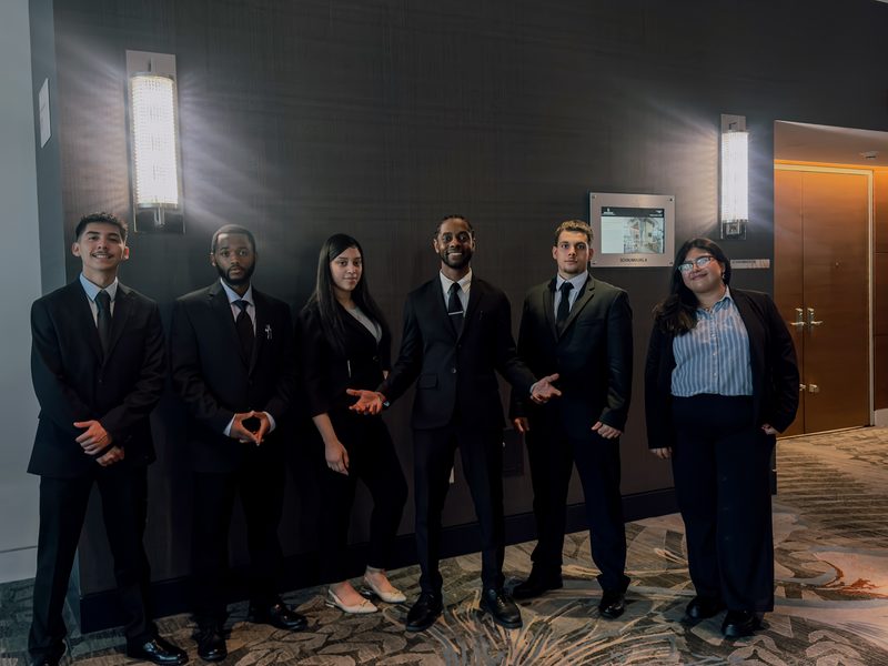 The Capacity Expansion Co team in professional attire at a company event