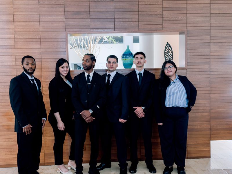 Capacity Expansion Co team members together in professional attire before a workday