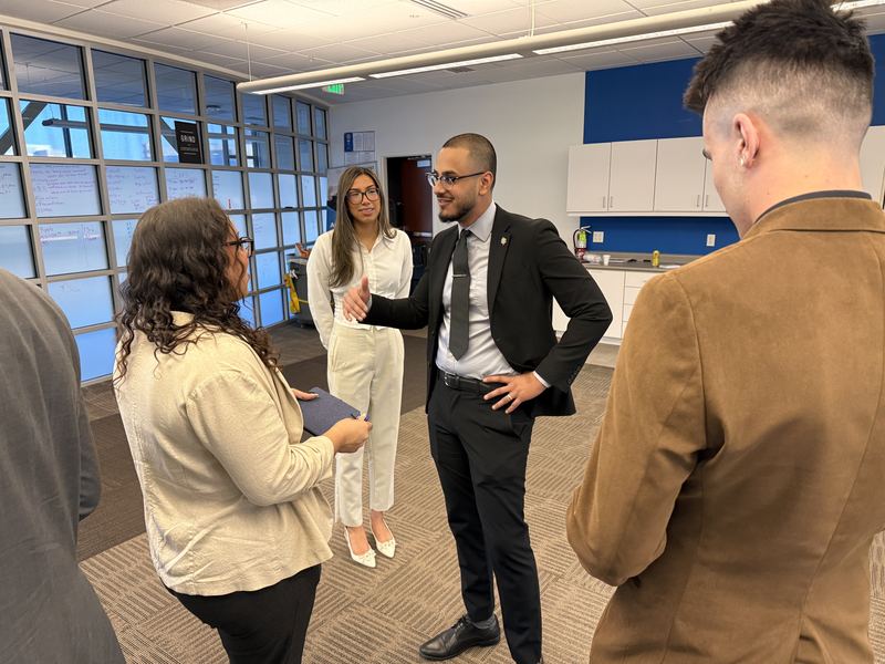 A Clarity leader coaching team members in the office