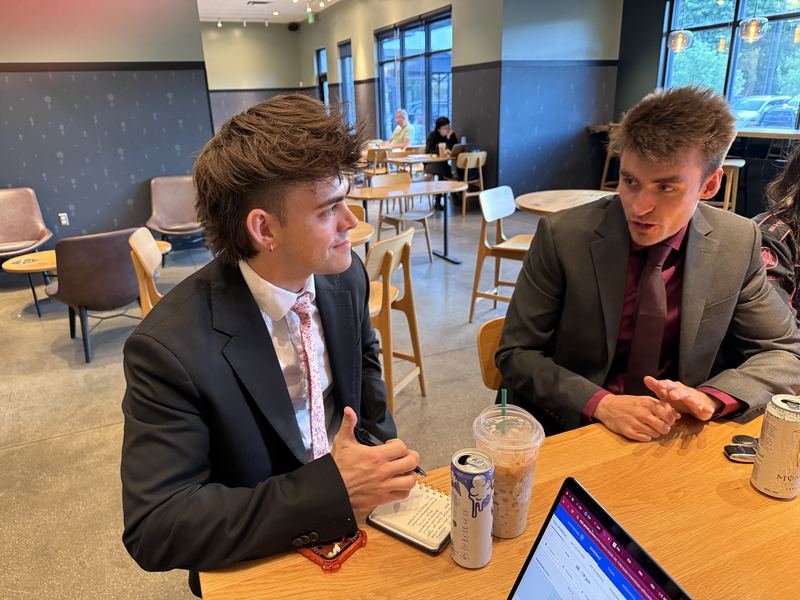 Two Clarity team members in a one-on-one coaching conversation