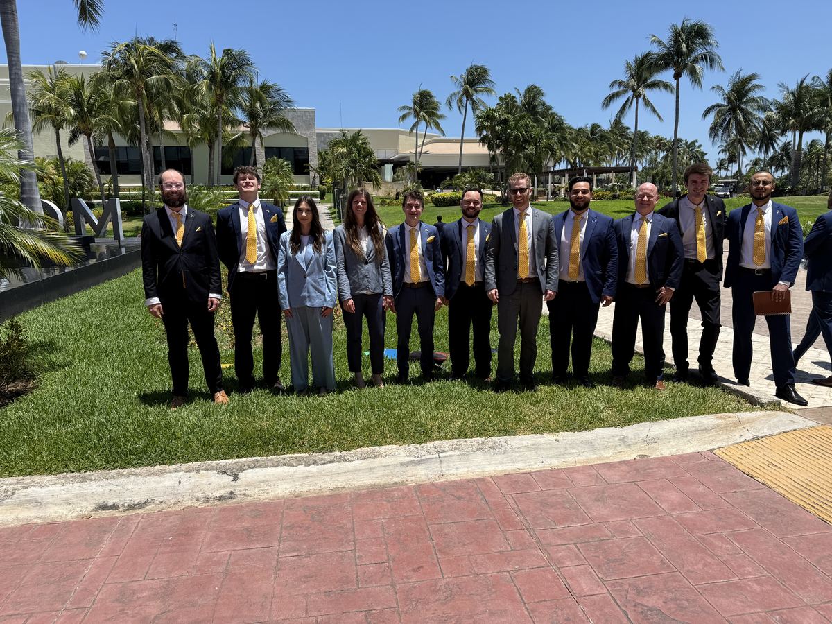 The Clarity Acquisitions team standing together outdoors in professional attire
