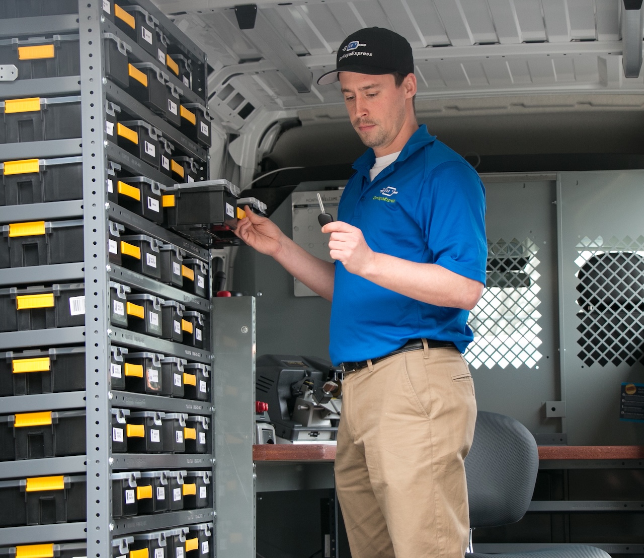 Car Keys Express technician accessing key inventory in service van