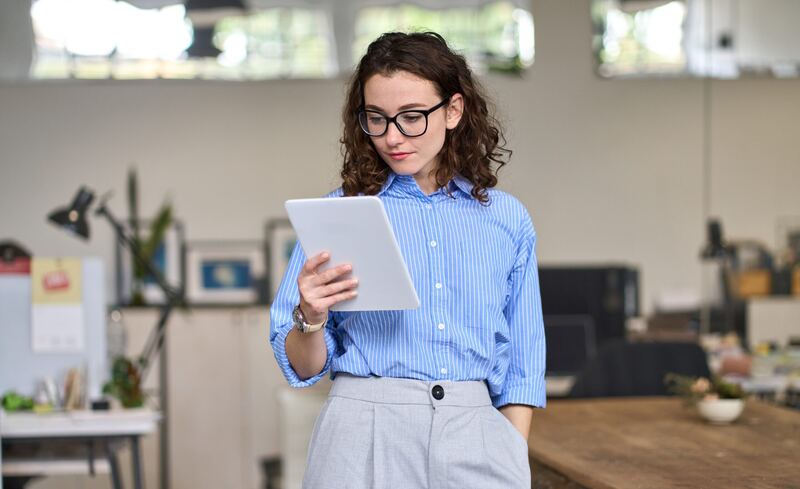Woman holding a tablet for a marketing job