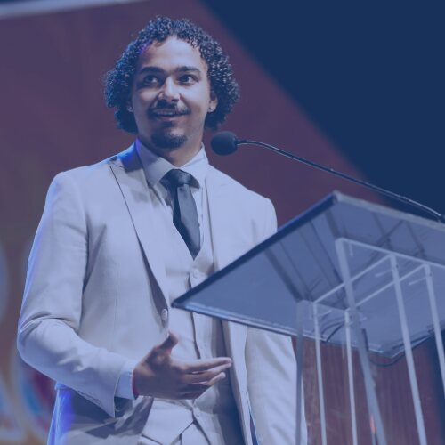 A Lone Star Acquisitions leader speaking at a company conference