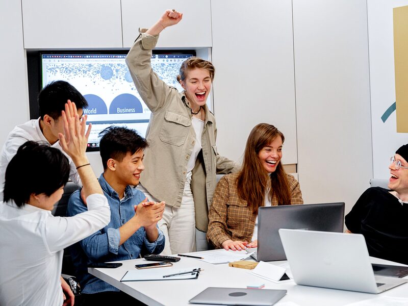 A team reviewing campaign results in a meeting room