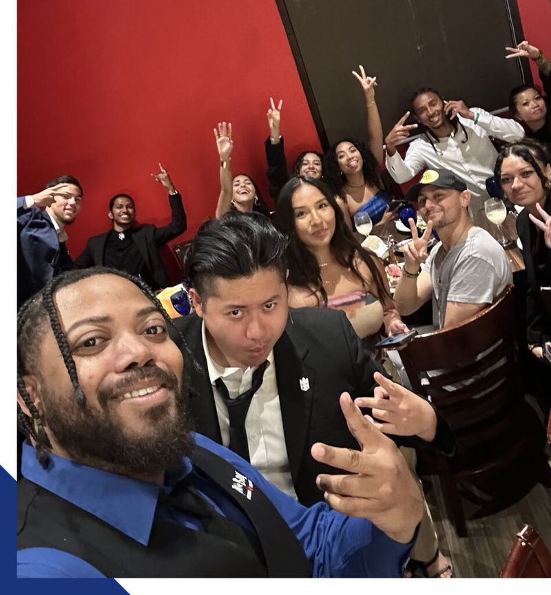 Mission III Management team taking a celebratory group selfie