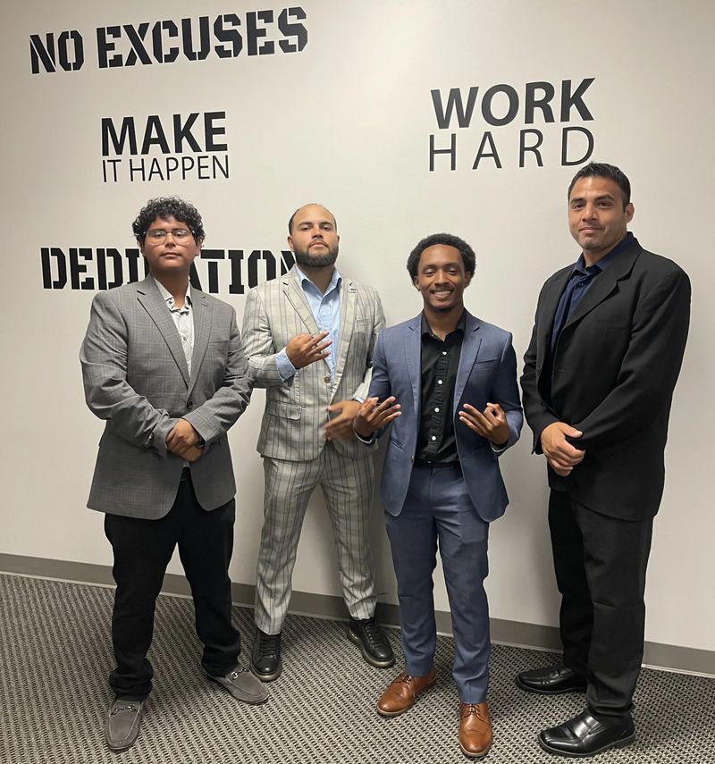 Mission III Management team members celebrating success together