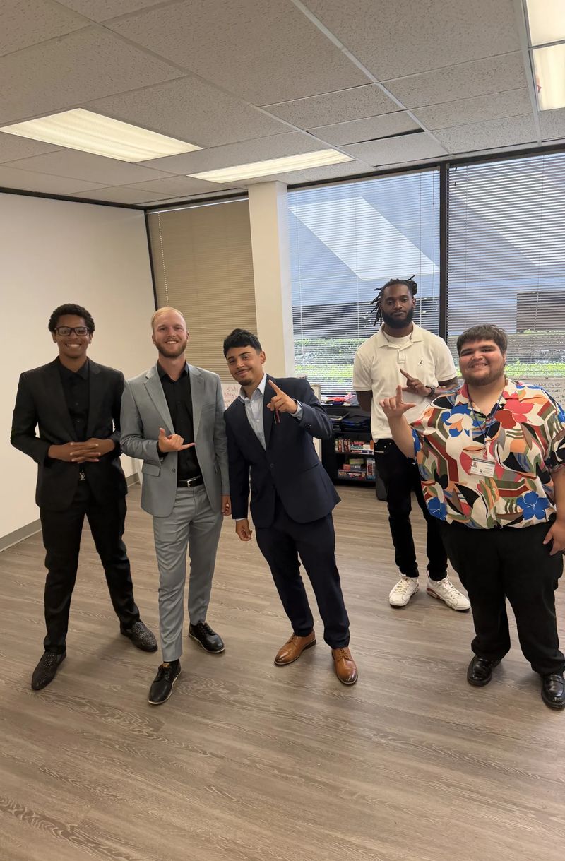 Mission III Management team members posing together at a company event