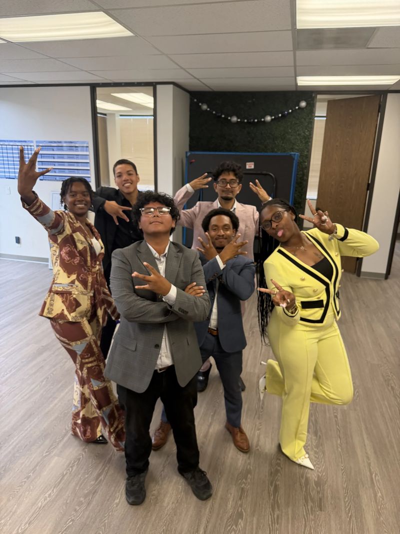 Mission III Management team members celebrating together at the office