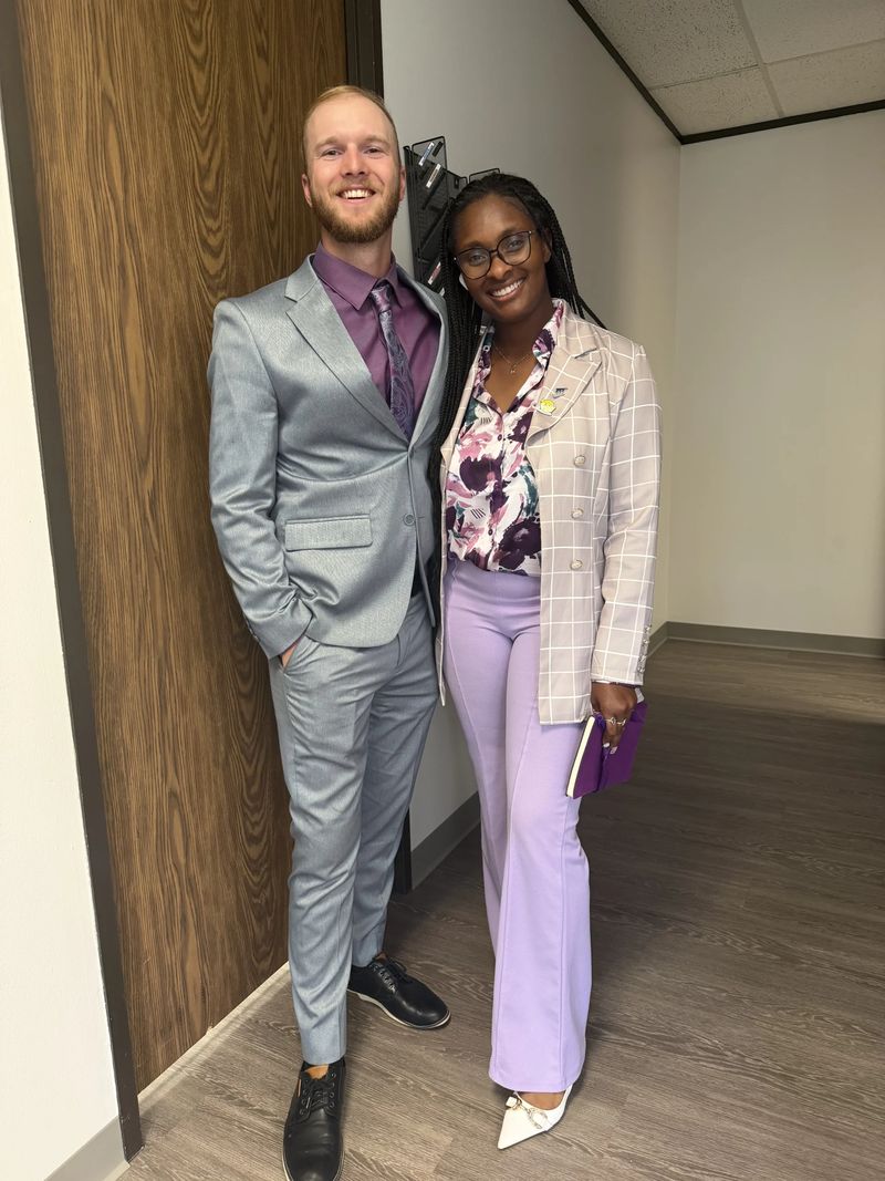 Two Mission III Management team members smiling together at the office