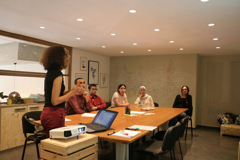 A business development professional presenting in front of people