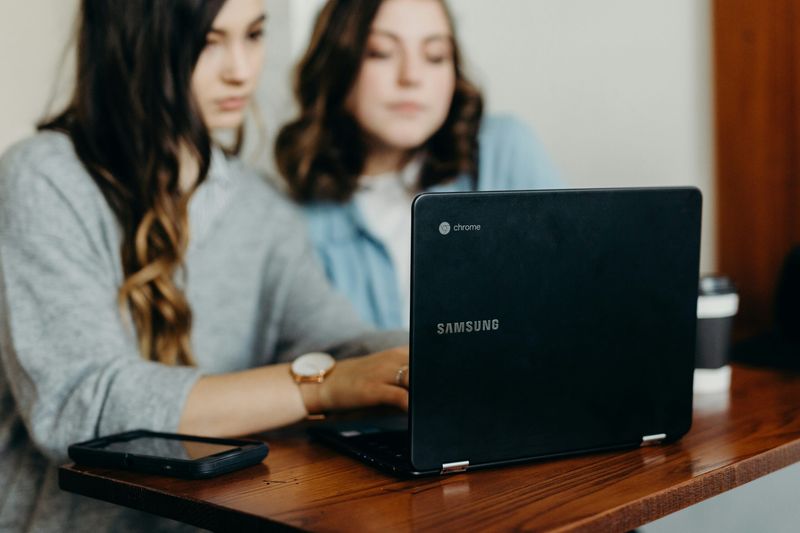 Two women applying for direct marketing internships online