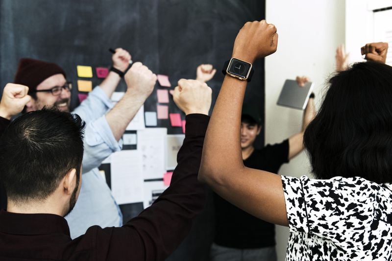A marketing team trying to build brand awareness together