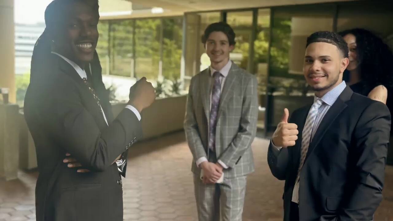 New Acquisitions team members in business attire outside the Atlanta office