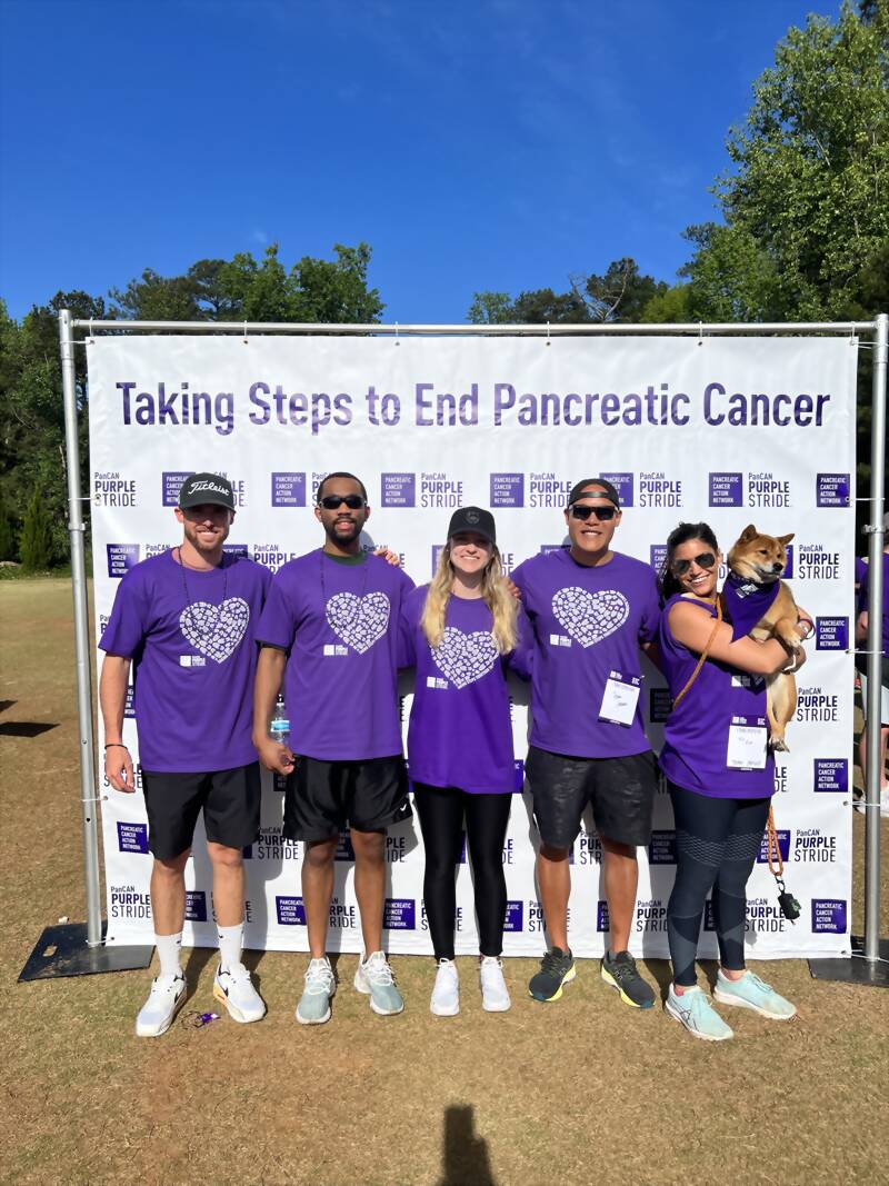 New Acquisitions team in purple shirts at the PanCAN PurpleStride pancreatic cancer walk