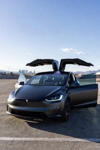 Tesla Model X waiting at the passenger pickup area of Harry Reid International Airport