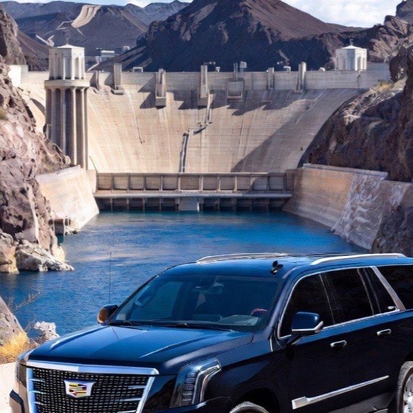Black Cadillac Escalade parked on the road overlooking the Hoover Dam