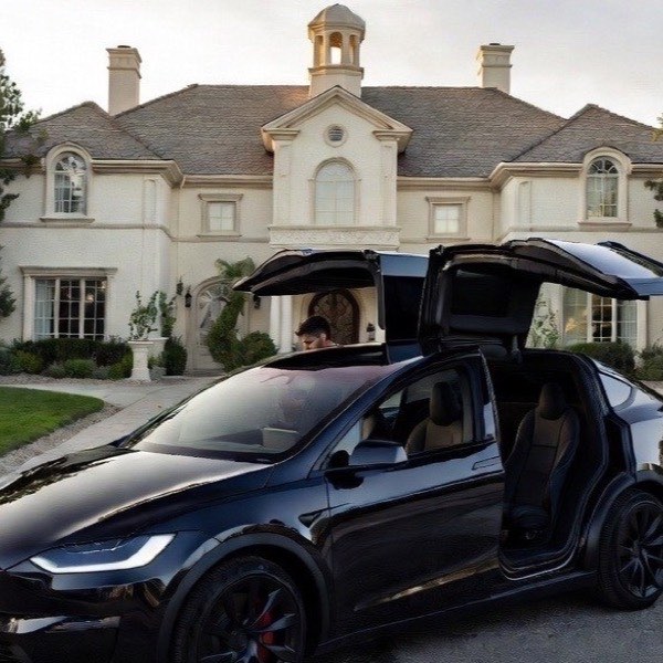 Tesla Model X picking up a passenger in a Las Vegas residential neighborhood