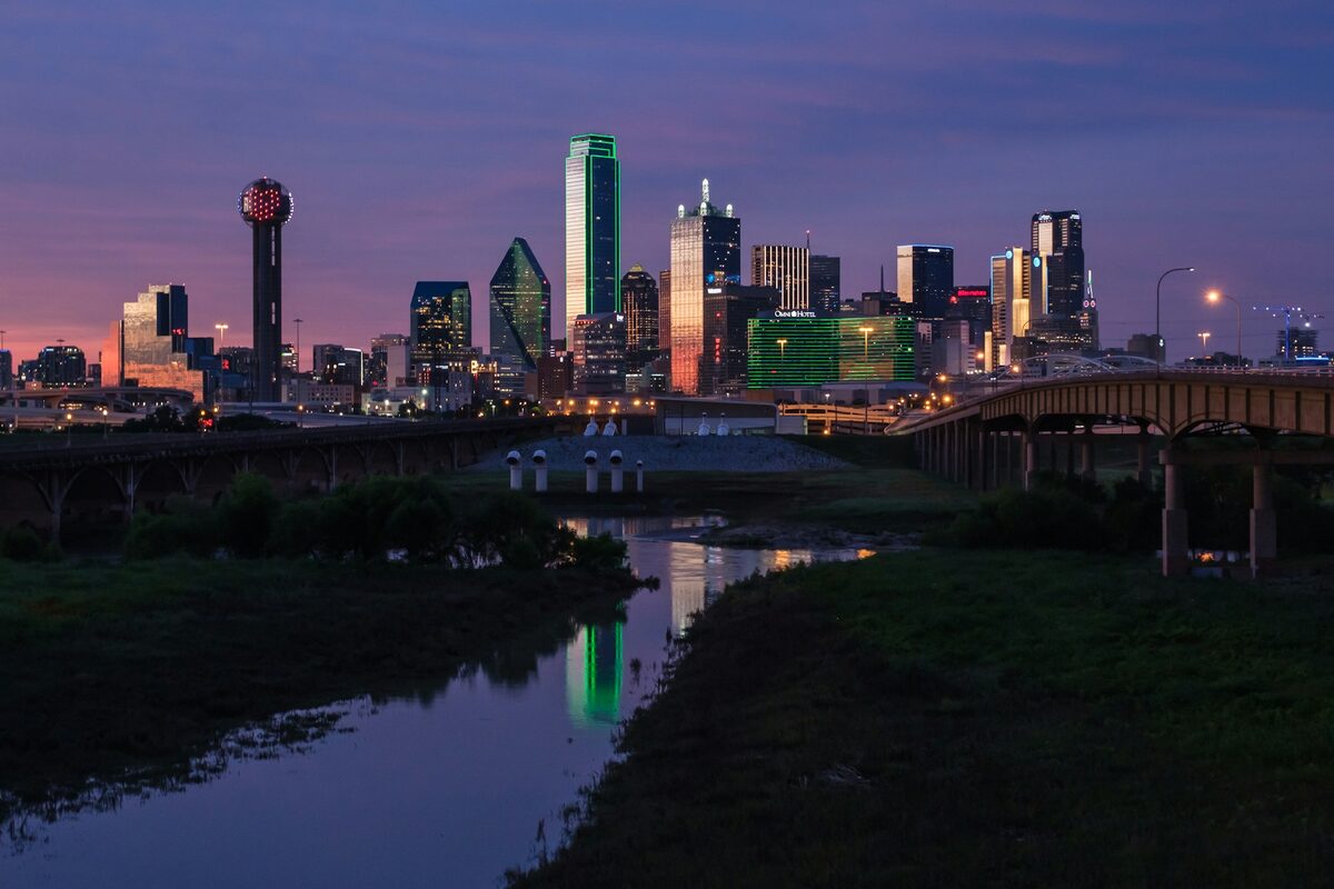 Downtown Dallas, Texas skyline at dusk reflected in the Trinity River