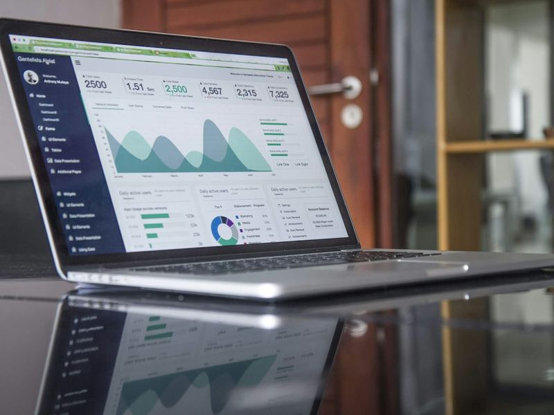 Laptop showing recruitment marketing analytics dashboards