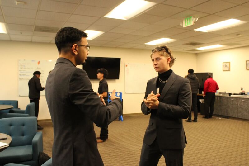 Sora Acquisitions team members in a face-to-face coaching conversation