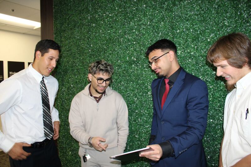 Sora Acquisitions representatives reviewing information together