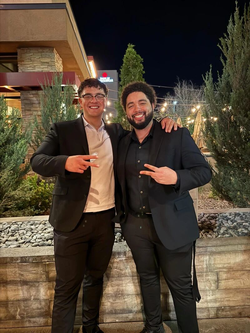 Two Super Nova Marketing colleagues smiling together outdoors in the evening