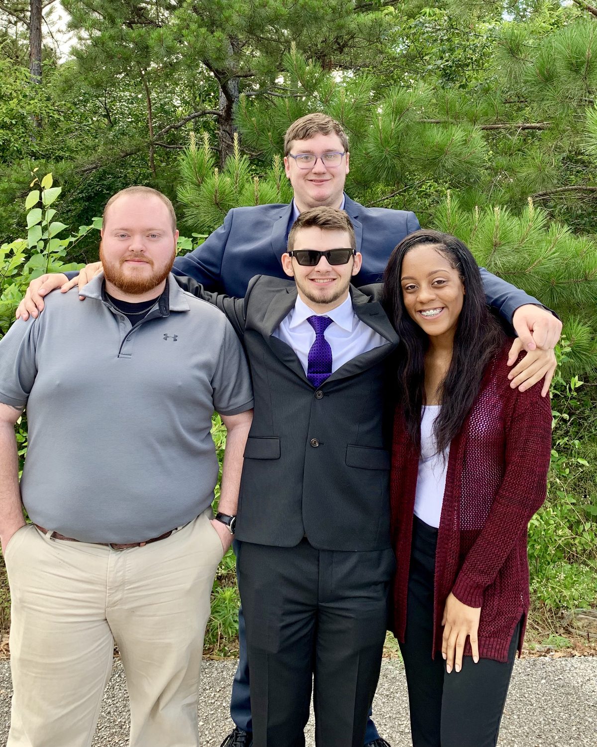 Four Vendex team members together outside the office